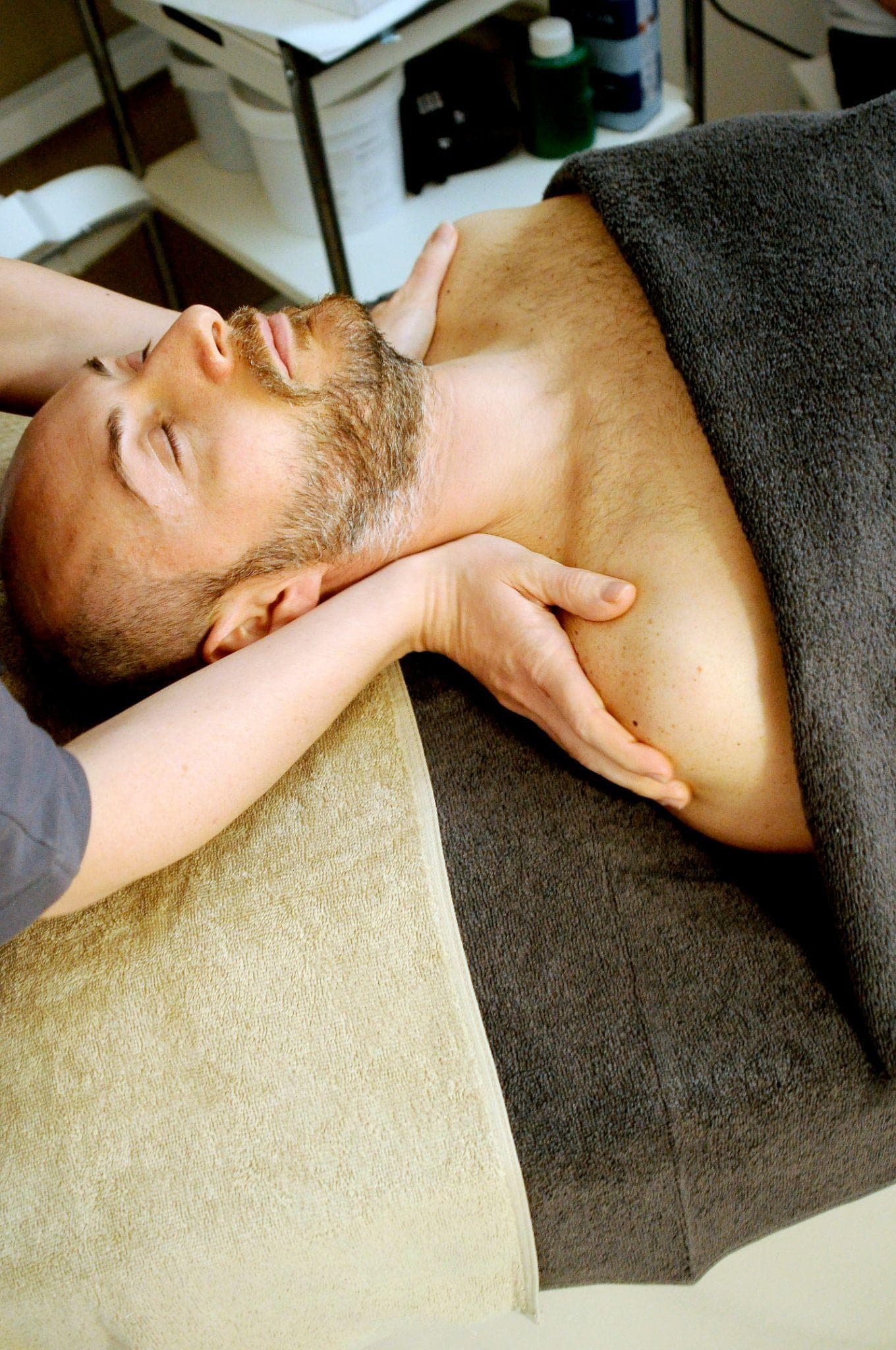 Person receiving a neck and shoulder massage